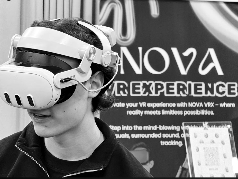 A visitor wearing a VR headset at a NOVA VRX event in Helsinki